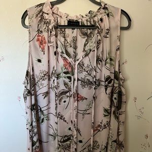Pale pink with olive green accents ruffle neck. Will need to wear with a cami.